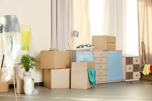Removal van in Wimbledon with moving boxes at a residential property