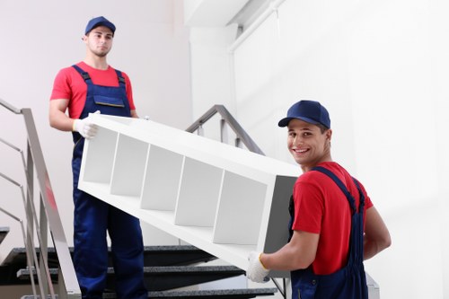 Moving large furniture through a narrow staircase in Wimbledon