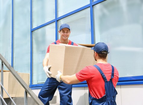 Local flat removals service in Wimbledon with a team planning a move near apartment buildings