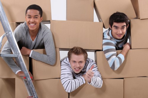 Furniture and boxes being loaded into a moving truck in Wimbledon
