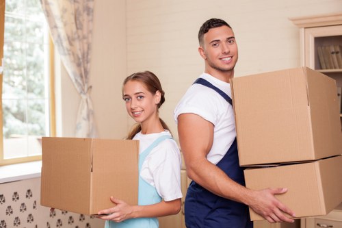 Planned office relocation in Wimbledon with labelled boxes and furniture ready for loading