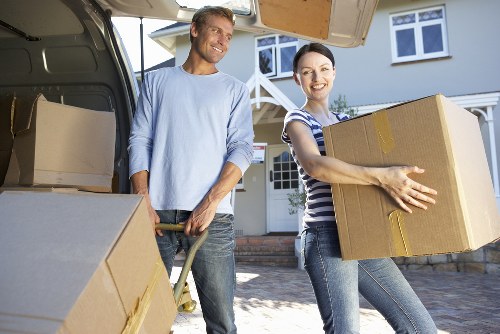 Mover wearing PPE while handling boxes safely