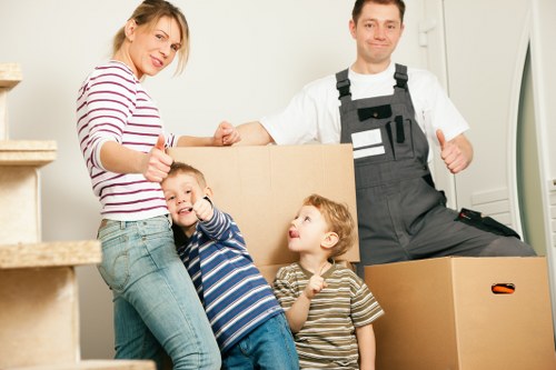 Local office movers handling desks and equipment in a Wimbledon business property